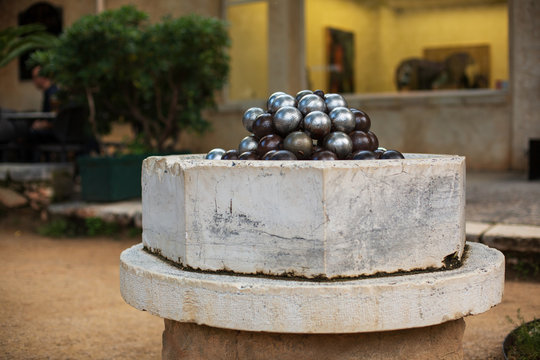 ..Pyramid of Petanque Balls on Street Background. Boccia. National Franch Game. Old Town. France