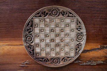 Wooden chess board on a wooden table