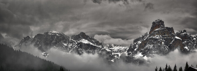 Fog and clouds around the snowy mountains