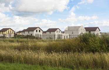 Country construction of cottages. Unfinished houses in the village.

