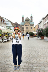 Thai woman show ice cream and eating on the road after travel visited Speyer town in Rhineland Palatinate, Germany