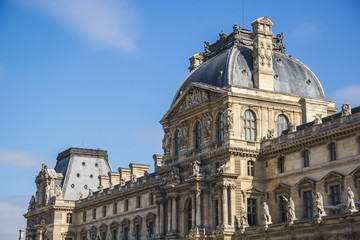 Fototapeta na wymiar Main building of Louvre Museum (Musée du Louvre) in a clear day