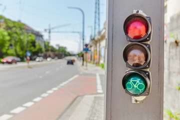 Traffic light with green bicycle sign, road safety and transportation in the city concept