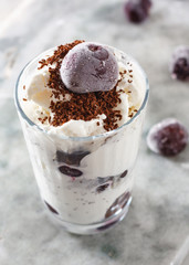 Ice cream with cherry berries on  marble countertop background