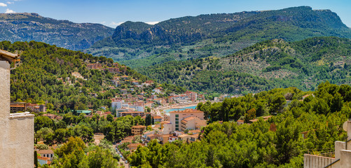 Fototapeta na wymiar Aerial panoramic view of Port de Soller Mallorca with beautiful mountain scenery of Sierra de Tramuntana