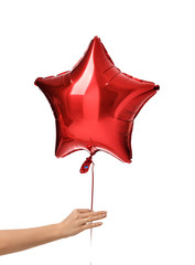Woman hand give single big red star latex balloon for birthday party isolated on a white