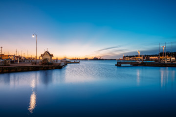 Fototapeta premium Helsinki, Finland. Landscape With City Pier, Jetty At Sunrise Ti