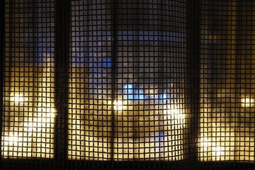 curtains looking like a net with an abstract night city background