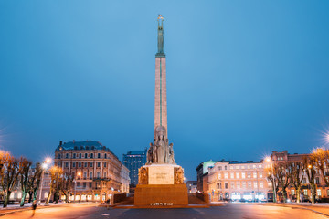 Riga, Latvia. Night View Of Memorial Freedom Monument At Freedom