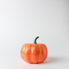 Halloween pumpkin on white background. Halloween minimal concept.