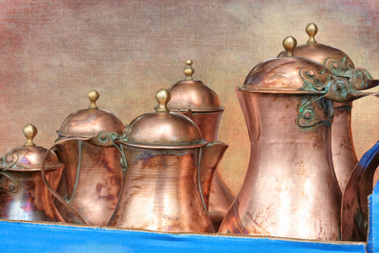 old copper pitcher on texture background