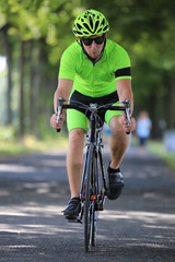 Fototapeta na wymiar Radrennfahrer - Sportlicher Mann auf Rennrad