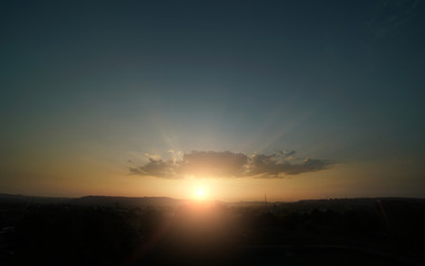 Beautiful sunset sky above clouds with dramatic light.