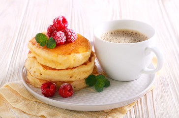 Pancakes with honey and raspberry