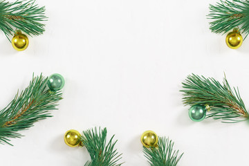Obraz na płótnie Canvas Christmas decoration. Christmas Tree with New Year's Glass Ball. Frame of pine branches. Flat lay, top view, copy space.