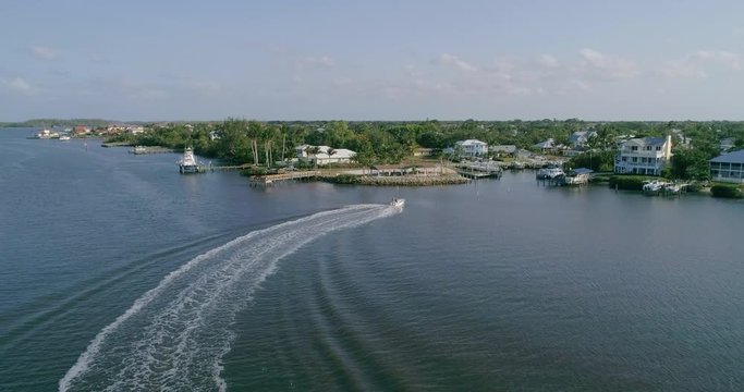 Zooming Out Aerial of a Speed Boat on River and Stuart Florida