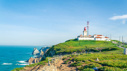 Fototapeta na wymiar Cabo da Roca, Portugal. Lighthouse and cliffs over Atlantic Ocean, the most westerly point of the European mainland.