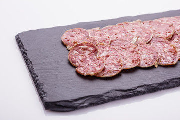 Saucisson sec delicious french salami on a white background