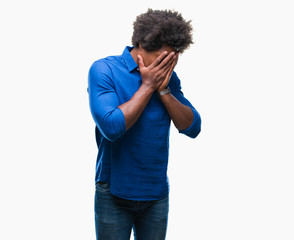 Afro american man over isolated background with sad expression covering face with hands while crying. Depression concept.