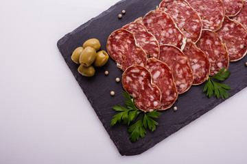 Saucisson sec delicious french salami on a white background