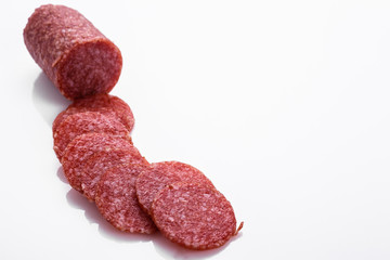 delicious sliced salami on a white background