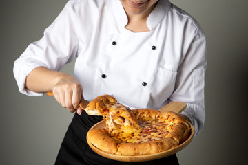 pizza pan in chef hand with cheese  stretch.italian food style traditional .