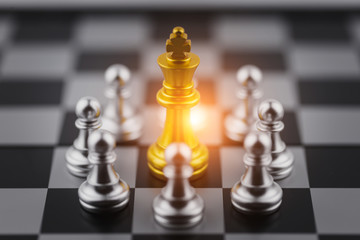 Gold king in chess game with Concept for company strategy,business victory or decision the path to...