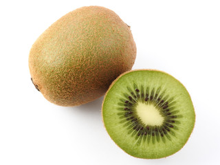 Top view of ripe fresh kiwifruits isolated on white background. Kiwi has fibrous, flesh and edible black seeds.Fruit, nature, health and nutrition concept. Summer food. Copy space.