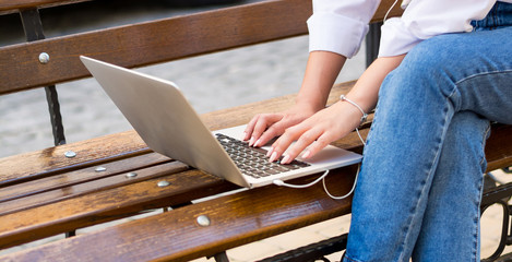 Hands of the woman who types on the laptop, closeup © allai