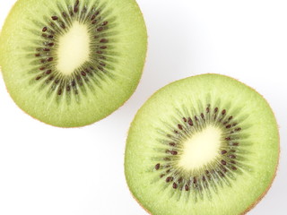 Top view and close up texture of ripe fresh sliced kiwifruits isolated on white background. With bright green flesh and edible black seeds.Sweet and unique taste.Natural, healthy and nutritious food.