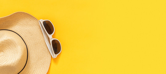 Flat lay traveler accessories on yellow background with blank space for text. Top view travel or vacation concept. Summer background.