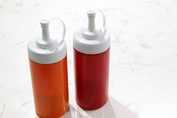 tomato ketchup and chilli sauce in plastic bottle