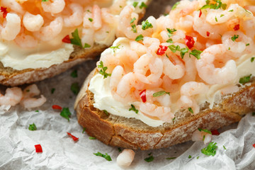 Prawns, shrimp seafood bruschetta with creamy cheese, parsley and chili