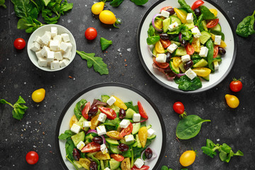 Fresh Greek salad with cucumber, cherry tomato, lettuce, red onion, feta cheese and black olives. Healthy food