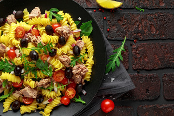 Pasta Tuna salad with tomatoes, wild rocket, black olives and red onion