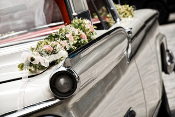 Old American limousine decorated as a wedding car