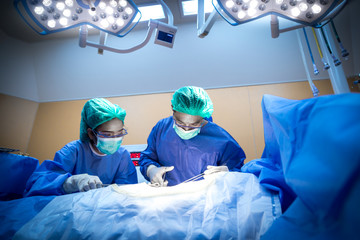Close up of Surgery team operating.