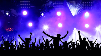 Naklejka na ściany i meble Dancing youth party, illustration. Crowd of cheerful people at a concert. Silhouettes of a crowd of fans in front of bright scene lights