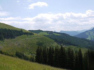 Mountain alndscape with cloudes, forest and fields