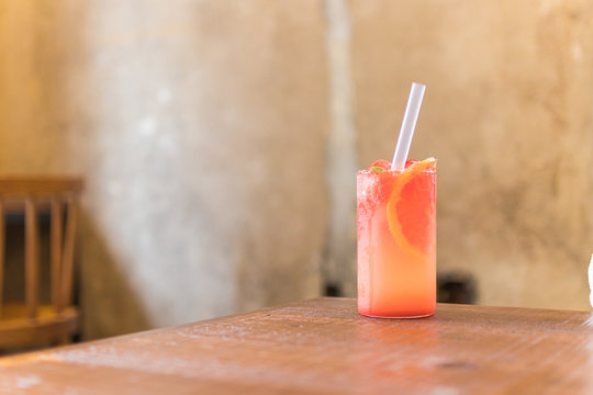 grapefruit juice on wooden table