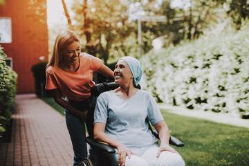 Woman with Mother. Cancer. Remission. Clinic.