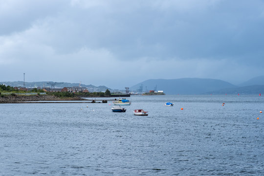 West Quey Port Glasgow looking over to the frontage of Greenock with the hillside in the misty distance