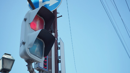 Stop light and Traffic light at intersection for people to walk in city of japan.