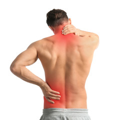 Young man suffering from neck pain on white background