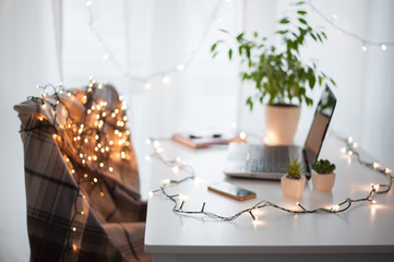 Freelancer's working place at home decorated for Christmas holiday
