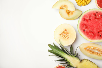 Flat lay composition with melon, other fruits and space for text on white background