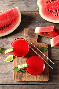 Summer watermelon drink in glasses served on table, top view
