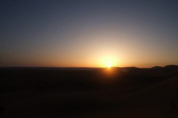Sunrise at the dawn over sand dunes at Erg Chebbi, Sahara desert. Merzouga, Morocco.