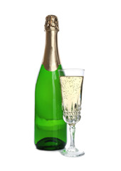 Bottle and glass with champagne on white background. Festive drink