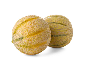 Whole tasty ripe melons on white background